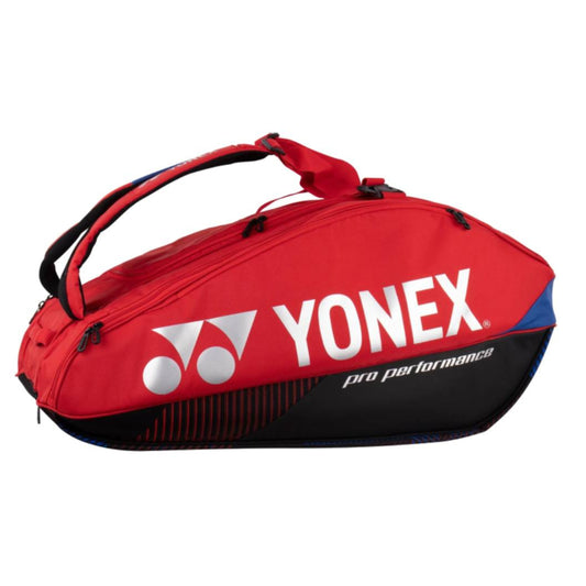 Red Yonex sports bag with visible branding on a white background