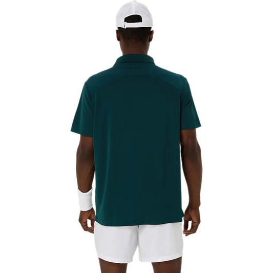 Person wearing a green polo shirt and white shorts on a white background