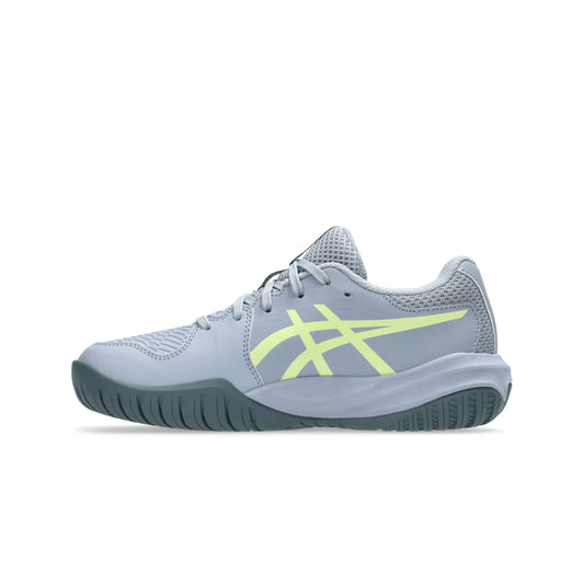 Gray tennis shoe with a yellow logo on a white background