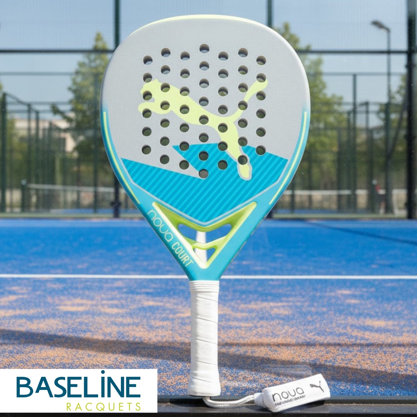 Puma padel racket on a padel court, with Baseline Raquets branding