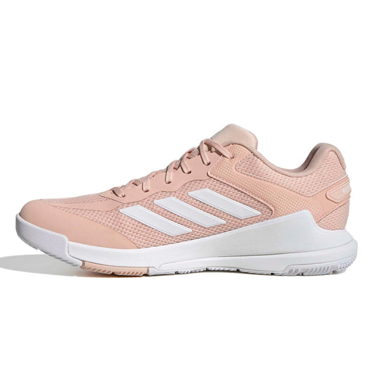Pink Adidas netball shoe with white sole on a white background