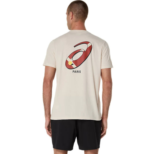 Man wearing a beige t-shirt with a Asics logo and 'Paris' text on the back, standing against a white background.