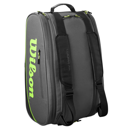 Grey padel bag with green Wilson logo on a white background