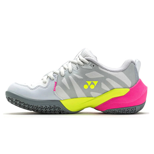 Gray and pink athletic Yonex shoe with yellow accents on a white background