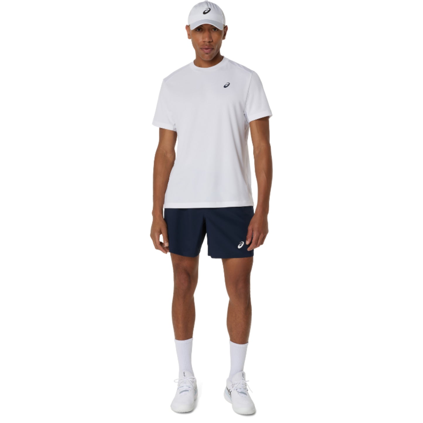 Man wearing a white t-shirt and navy shorts with a visible brand logo on a white background