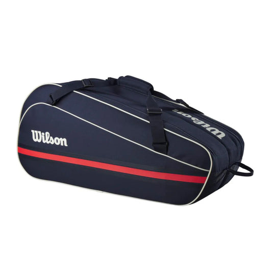 Navy blue tennis bag with red stripe and Wilson logo on a white background