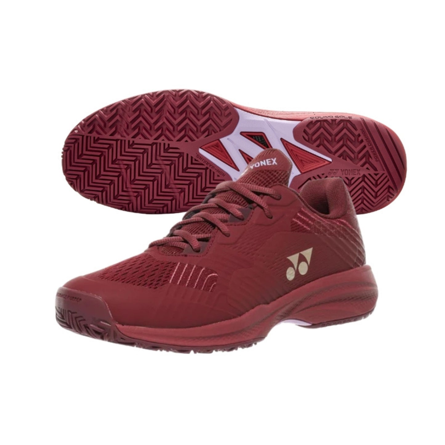 Red Yonex tennis shoes with a brand logo on a white background