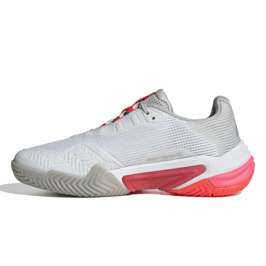 White and pink tennis shoe on a white background