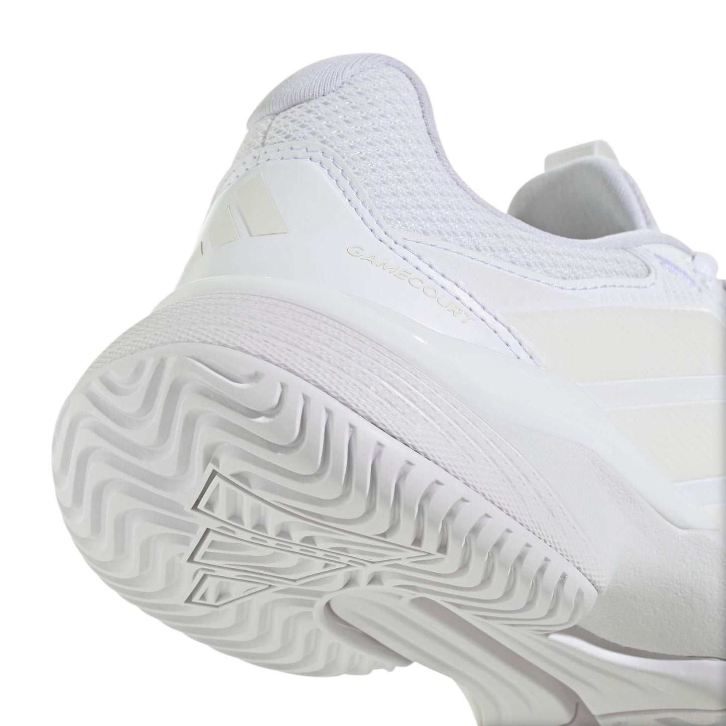 White Adidas tennis shoe with sole pattern on a white background