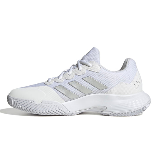 White Adidas tennis shoe with three silver stripes on a white background