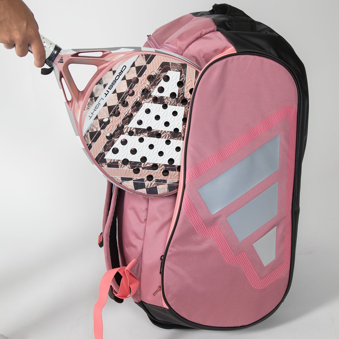 Pink adidas Padel bag with a padel and racket on a white background