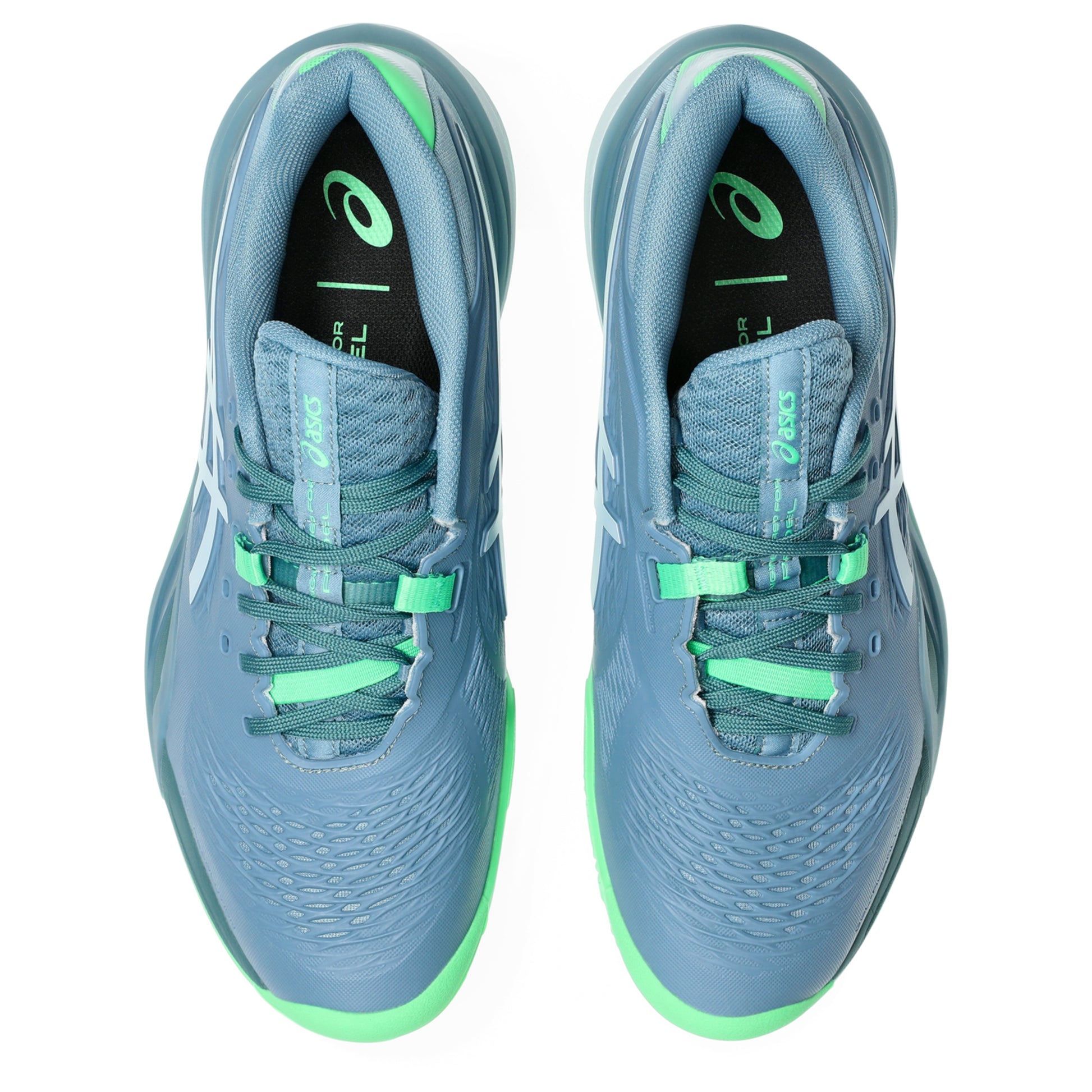 Pair of blue and green padel shoes on a white background