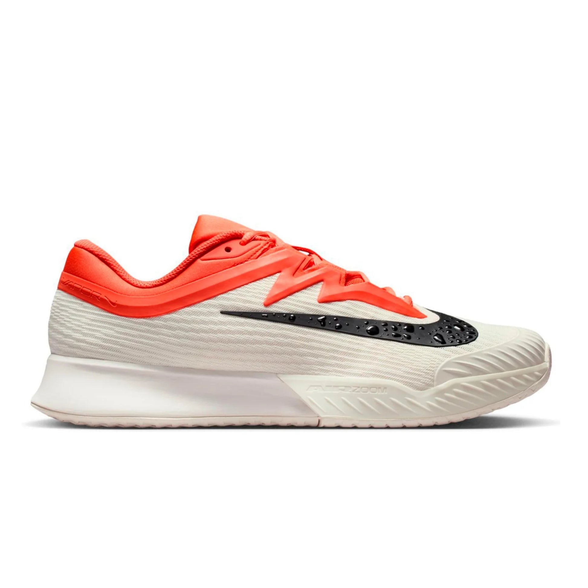 Orange, white and black Nike tennis shoe on a white background