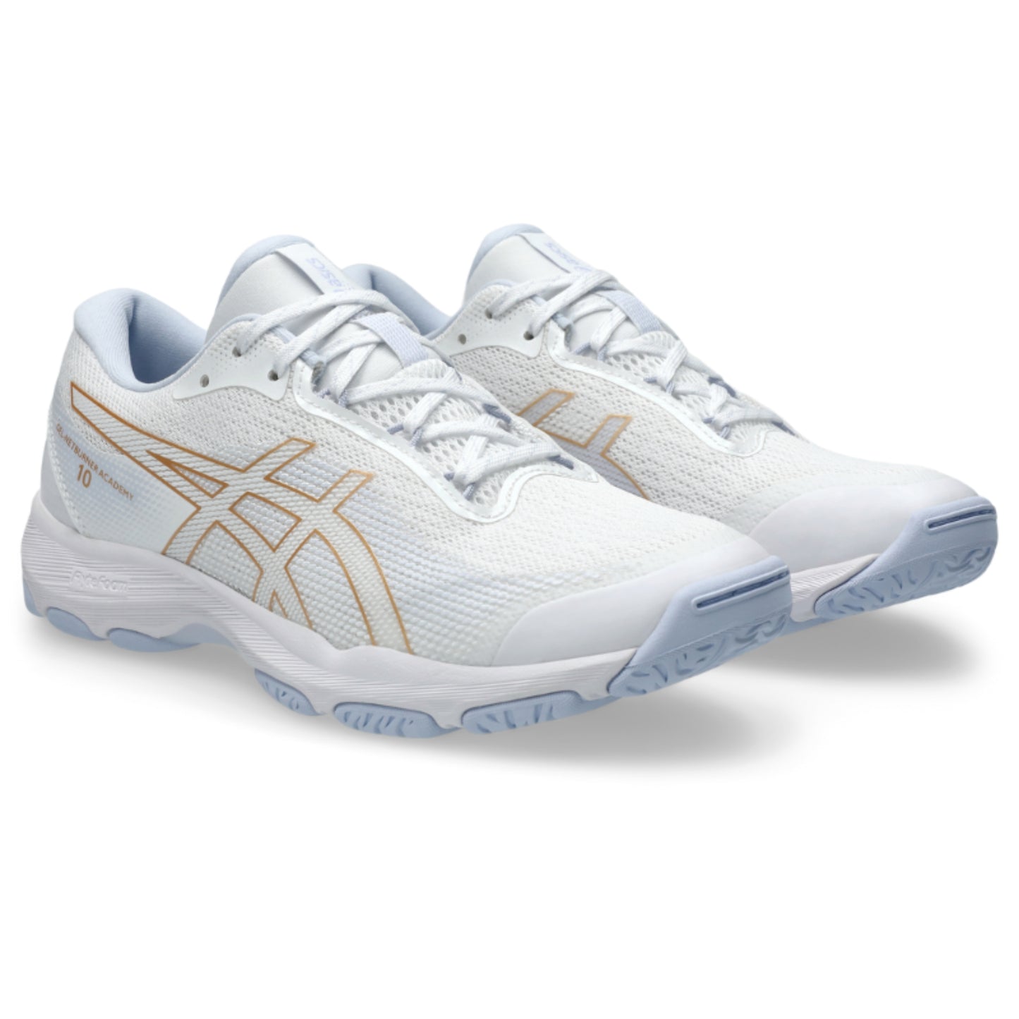 White tennis shoes with gold accents on a white background