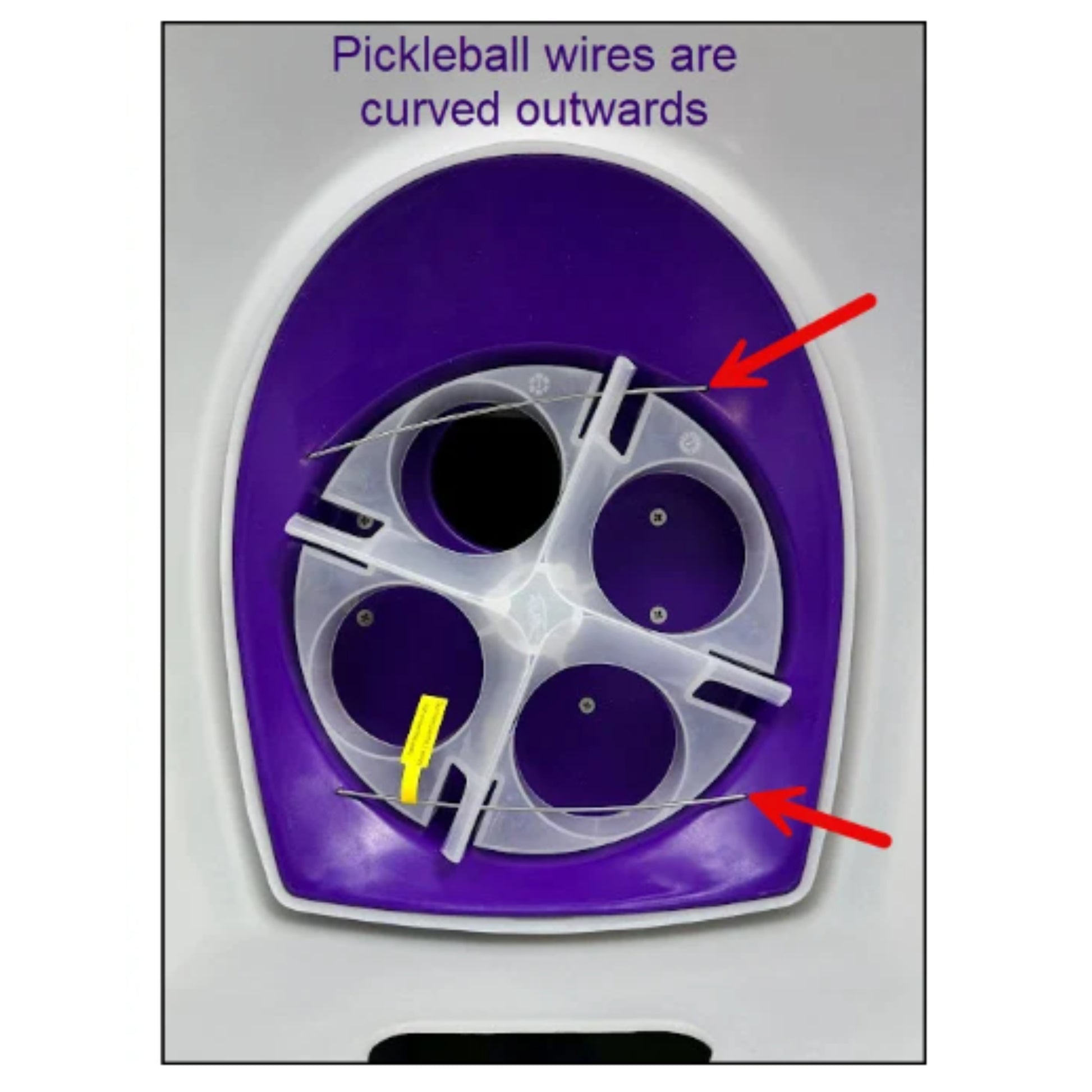 Close-up of a pickleball paddle with text and arrows indicating curved wires.