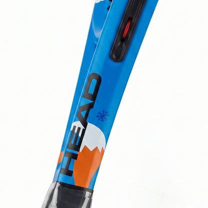 Close-up of a blue HEAD racquet shaft with black, white, and orange graphics, featuring the HEAD logo and a red switch on a white background.