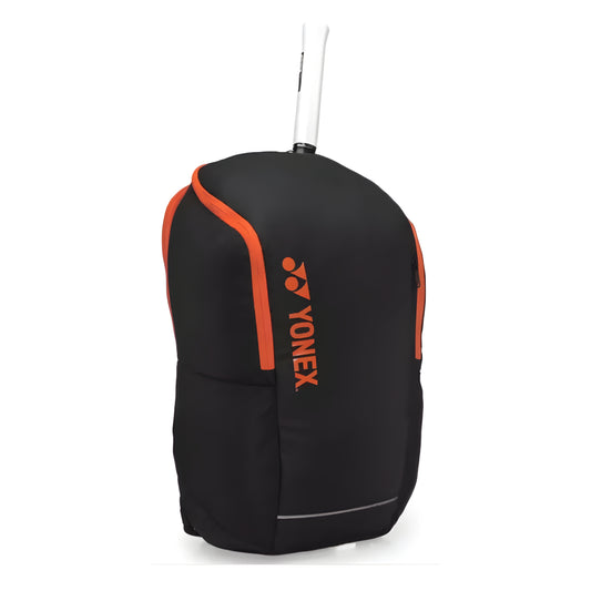 Black and orange Yonex backpack on a white background