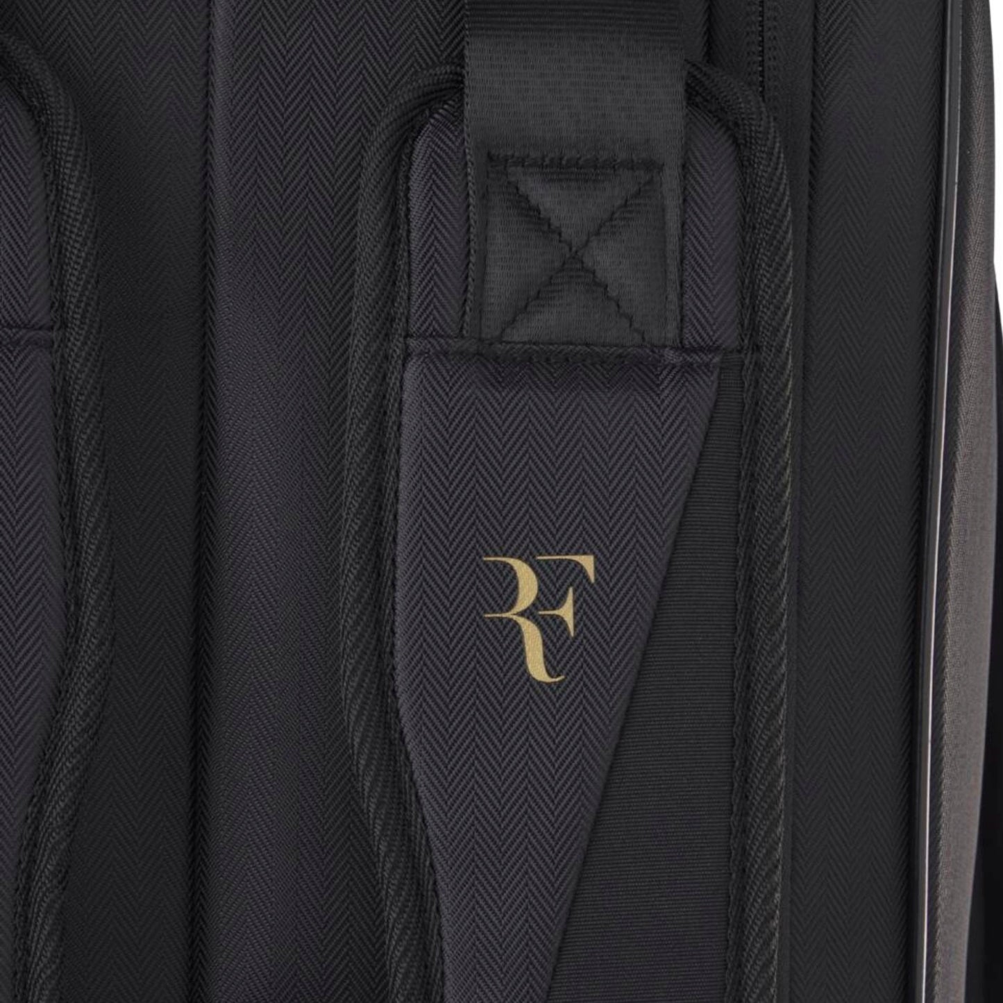 Black tennis bag with a gold logo on a black background