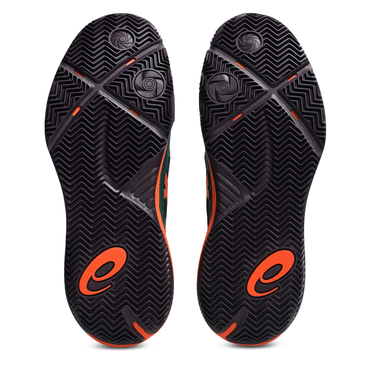 A pair of padel shoes soles shown from the bottom, featuring a black textured chevron pattern with bright orange logo accents and small orange details.