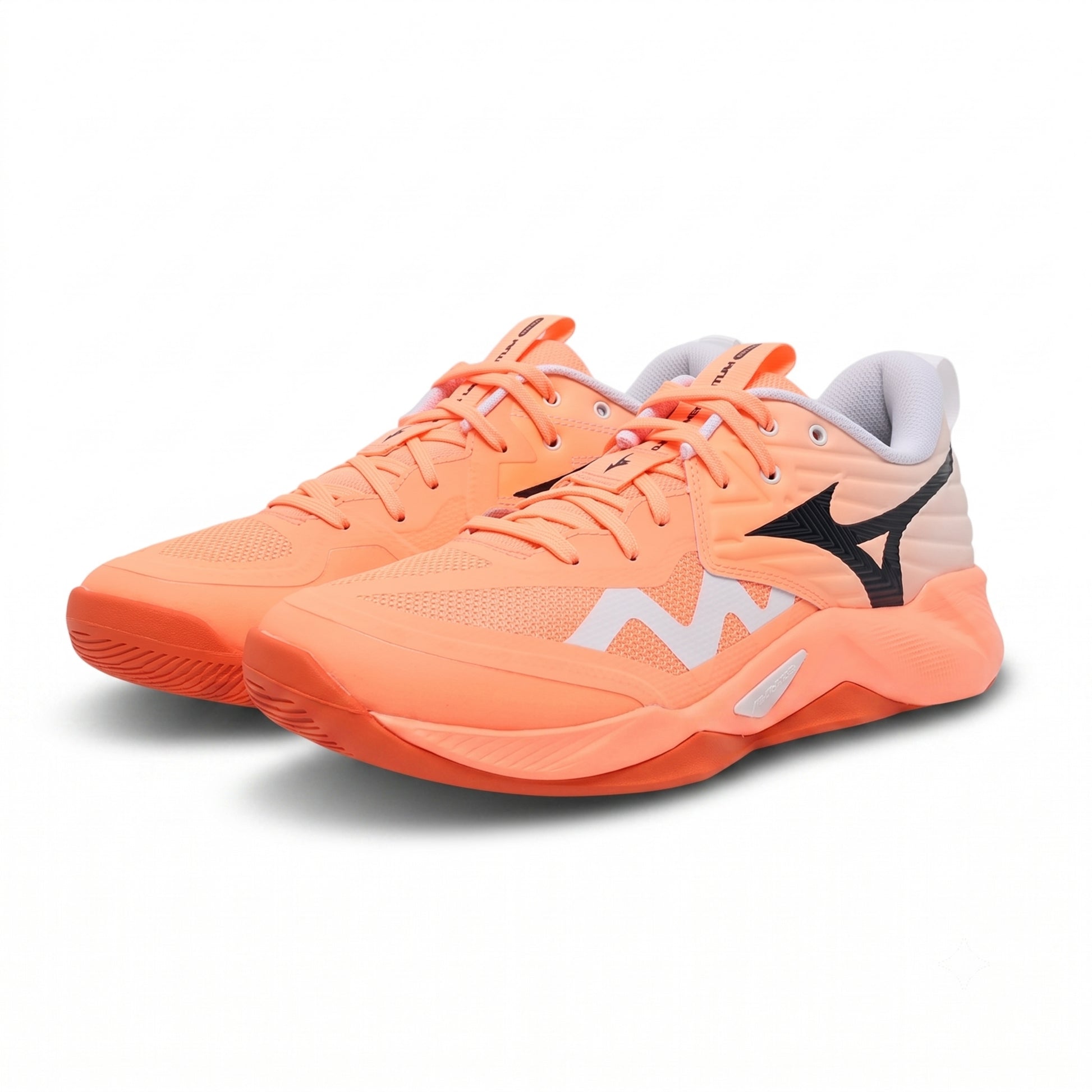 A pair of Mizuno squash shoe in a vibrant coral orange colorway, featuring a white and black logo design on the side, photographed against a clean white background.
