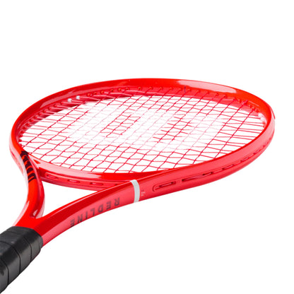 A close-up of a red Wilson tennis racket with a black grip, shown against a solid white background.