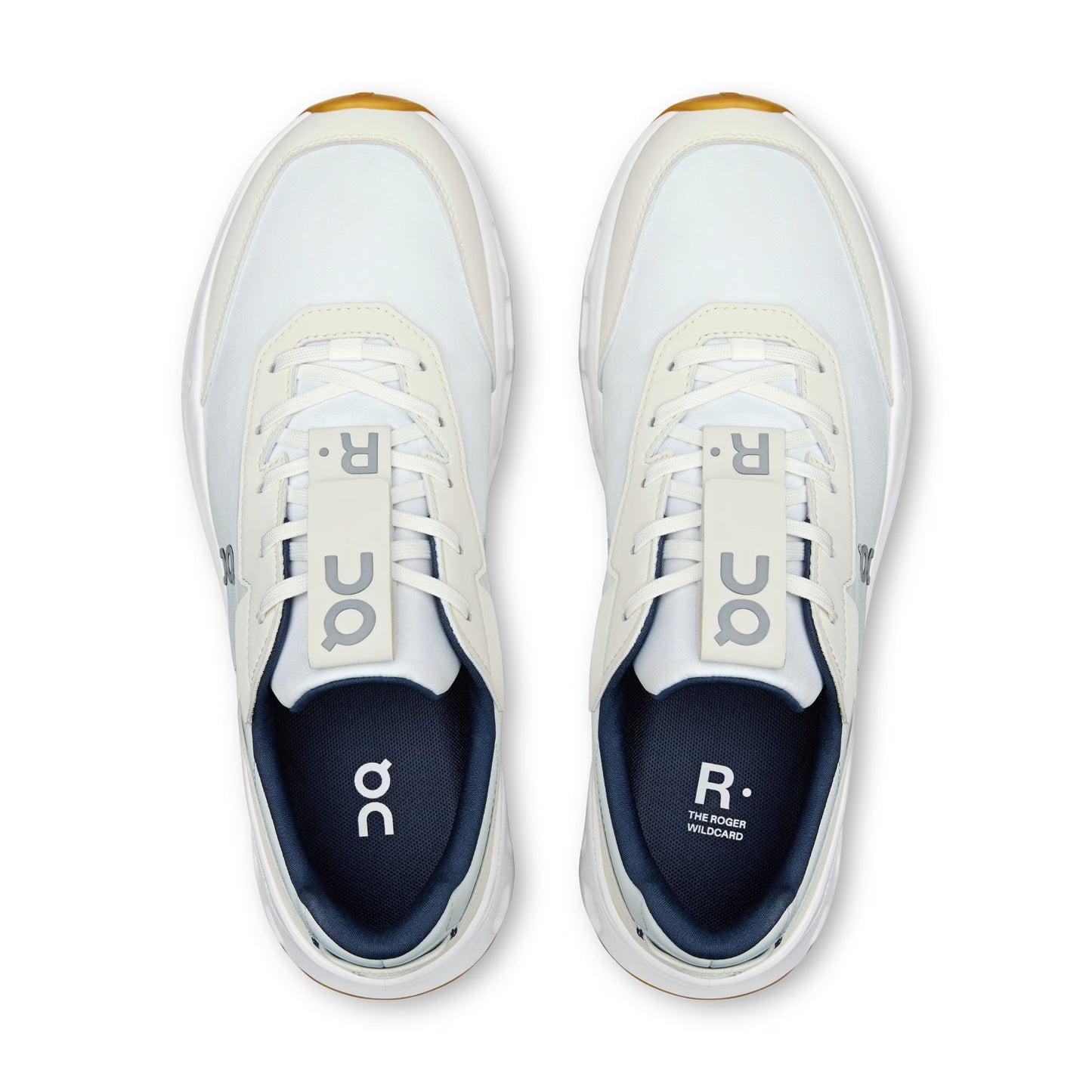 A pair of white and navy blue On tennis shoes shown from a top-down view on a clean white background.