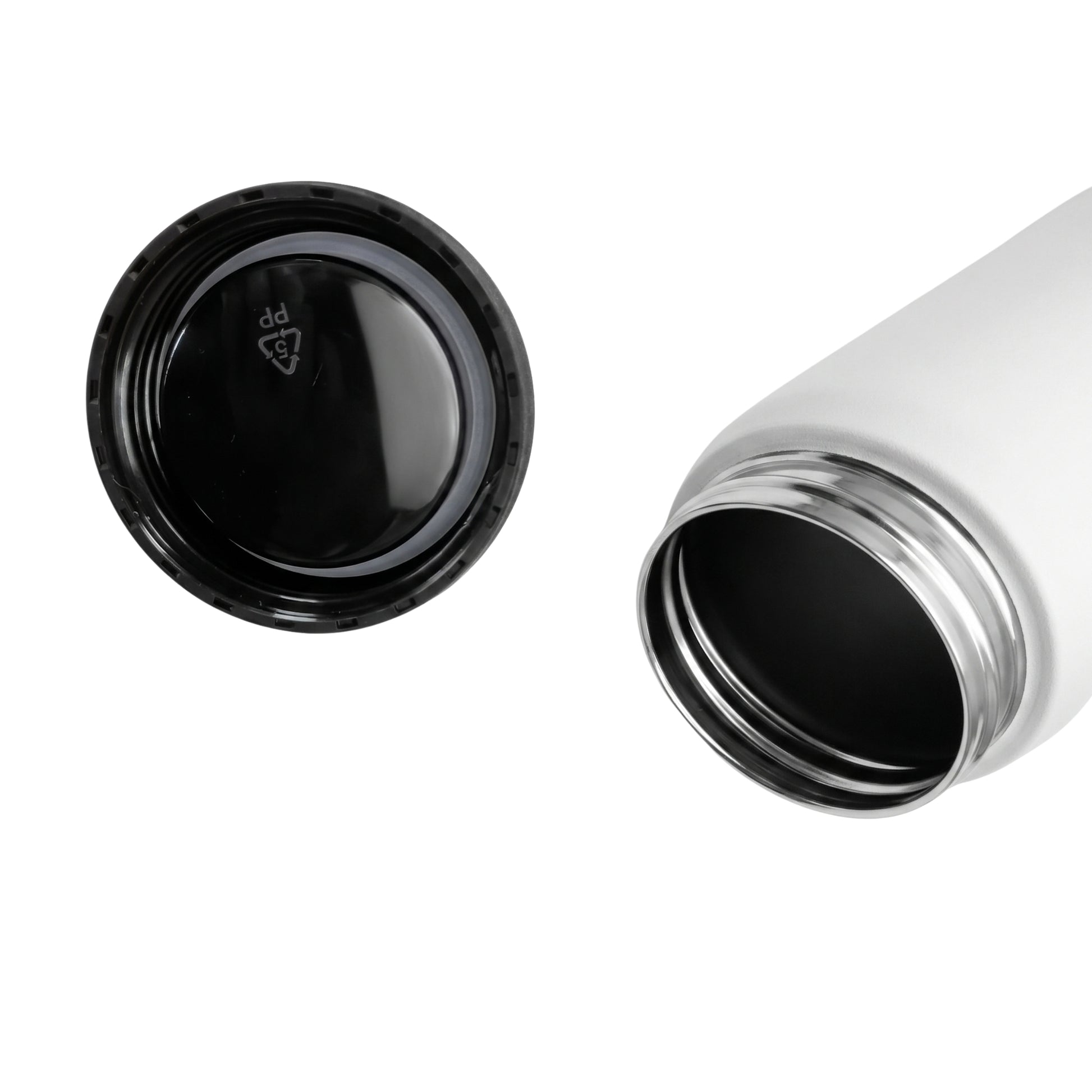 Detail of a white water bottle and a black cap on a white background