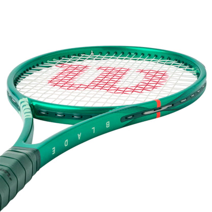 Green Wilson tennis racket with red Wilson logo on a white background