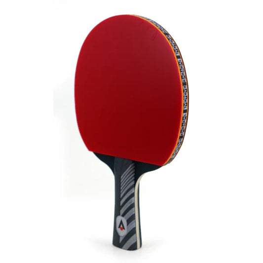 Table tennis bat side view, with top as a red colour and black edge with markings, bottom handle black with Karakal logo in front 