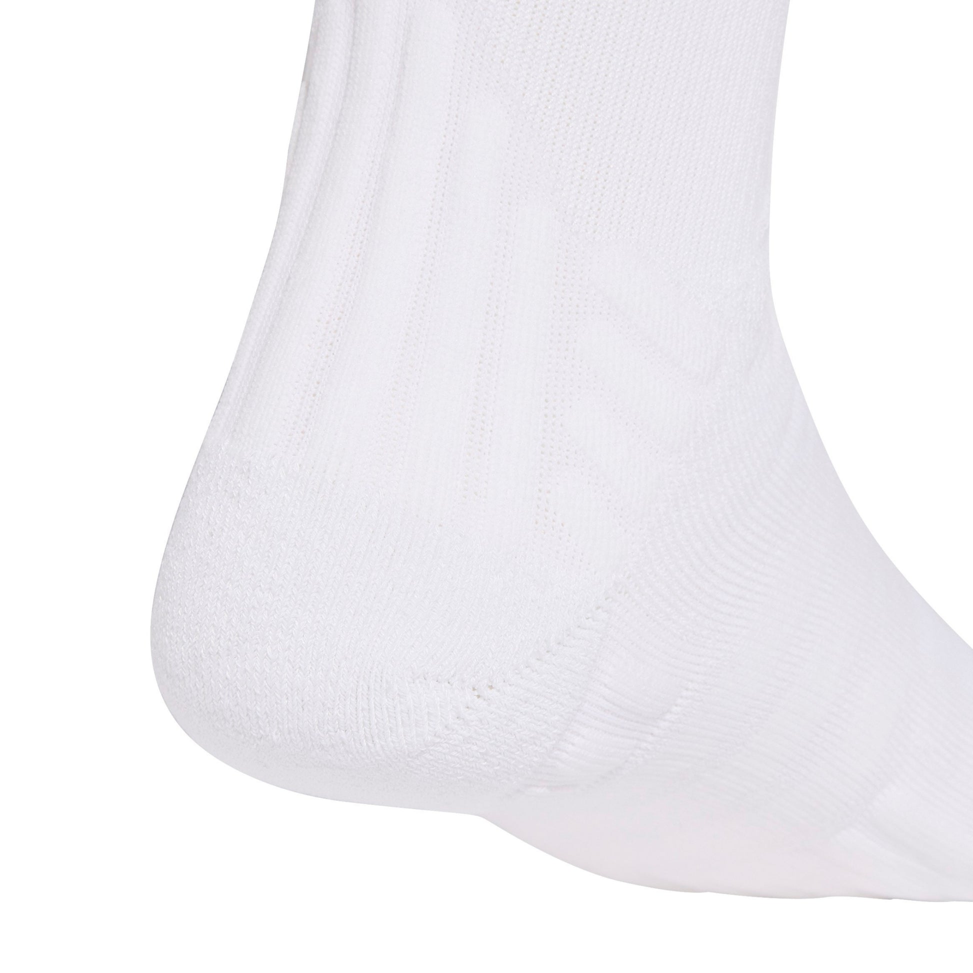 A close-up of a white athletic sock showing the textured knit pattern on the side of the leg, set against a solid white background.