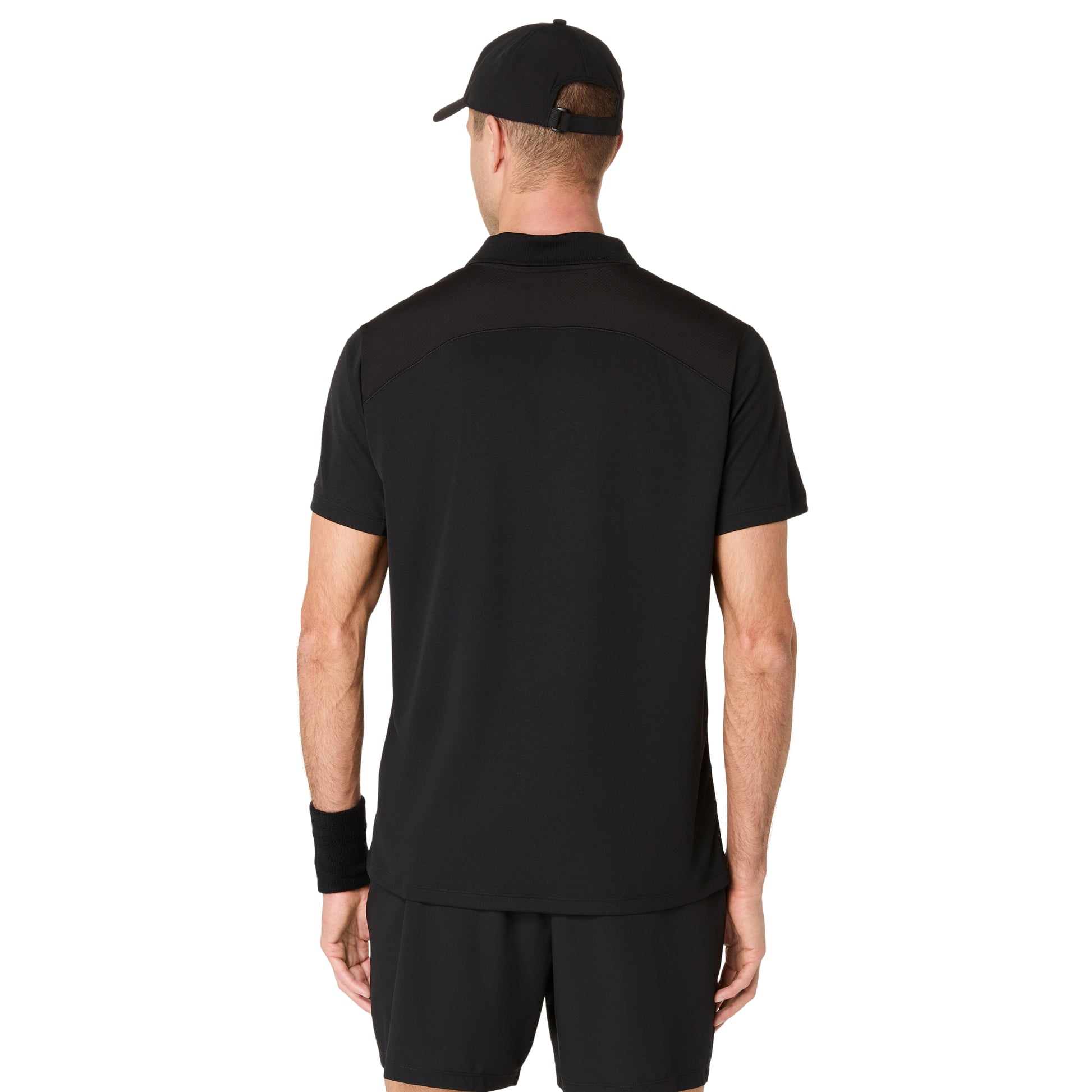 Man wearing a black polo shirt showing the back of the shirt on a white background