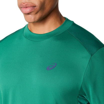 Green athletic shirt with a Asics brand logo on a white background