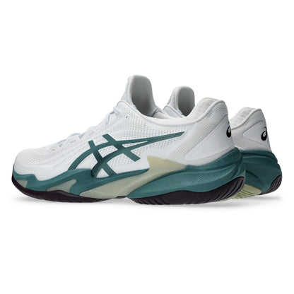 White and dark green Asics tennis shoes with a black sole on a white background
