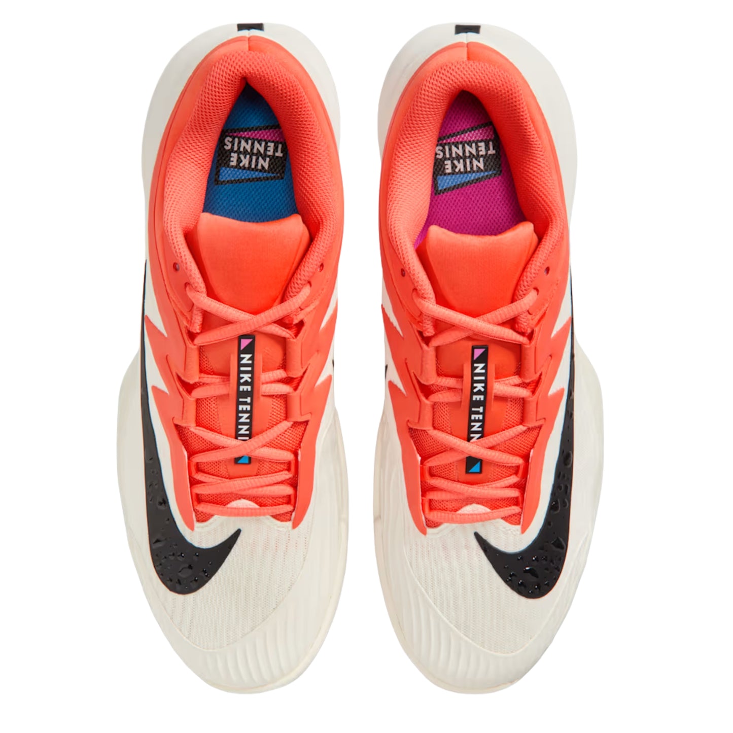 Orange, white and black Nike tennis shoes on a white background