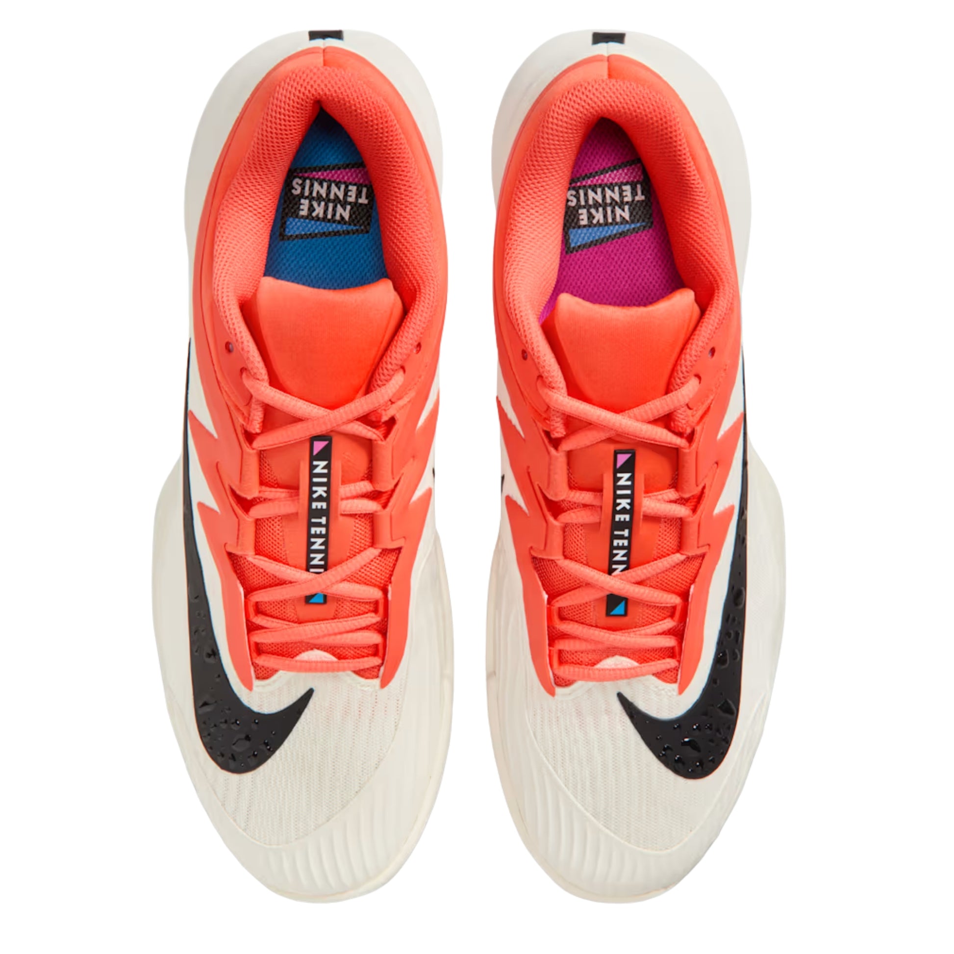 Orange, white and black Nike tennis shoes on a white background