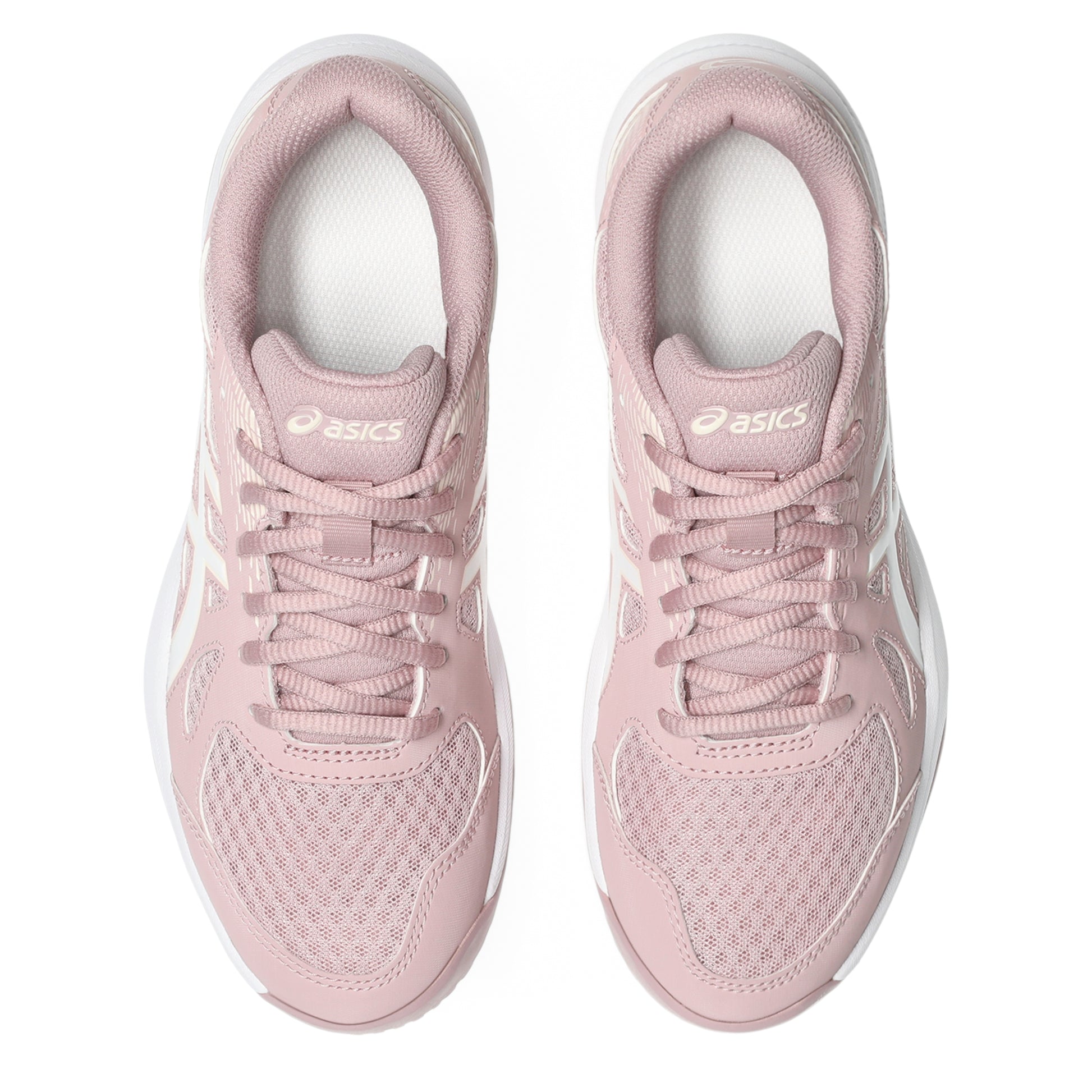 Pair of pink athletic shoes with white laces on a white background