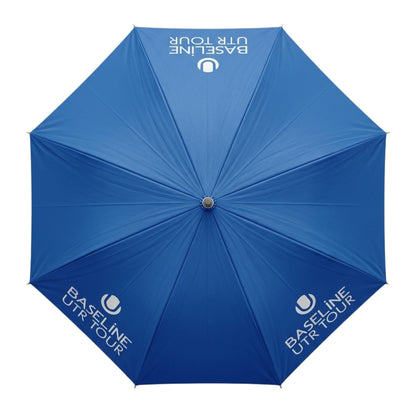 Blue umbrella with White Baseline UTR Tour logo