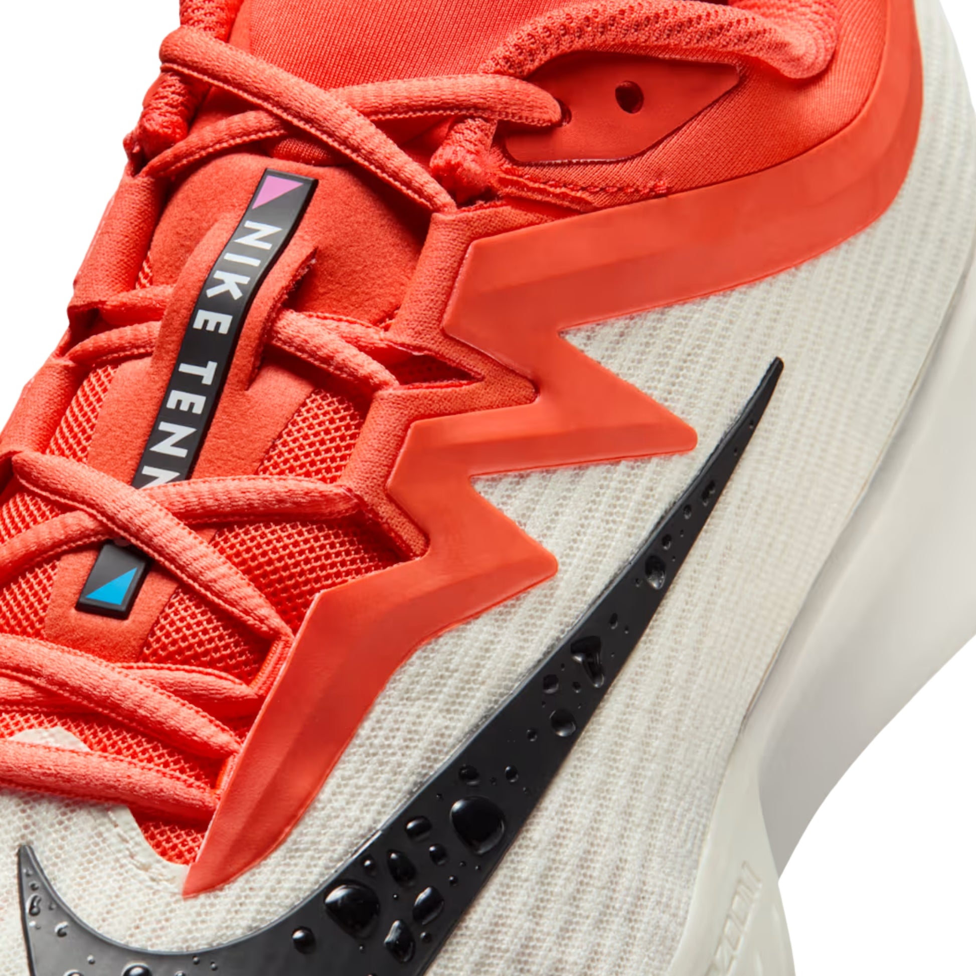 Orange and white Nike shoe on a white background