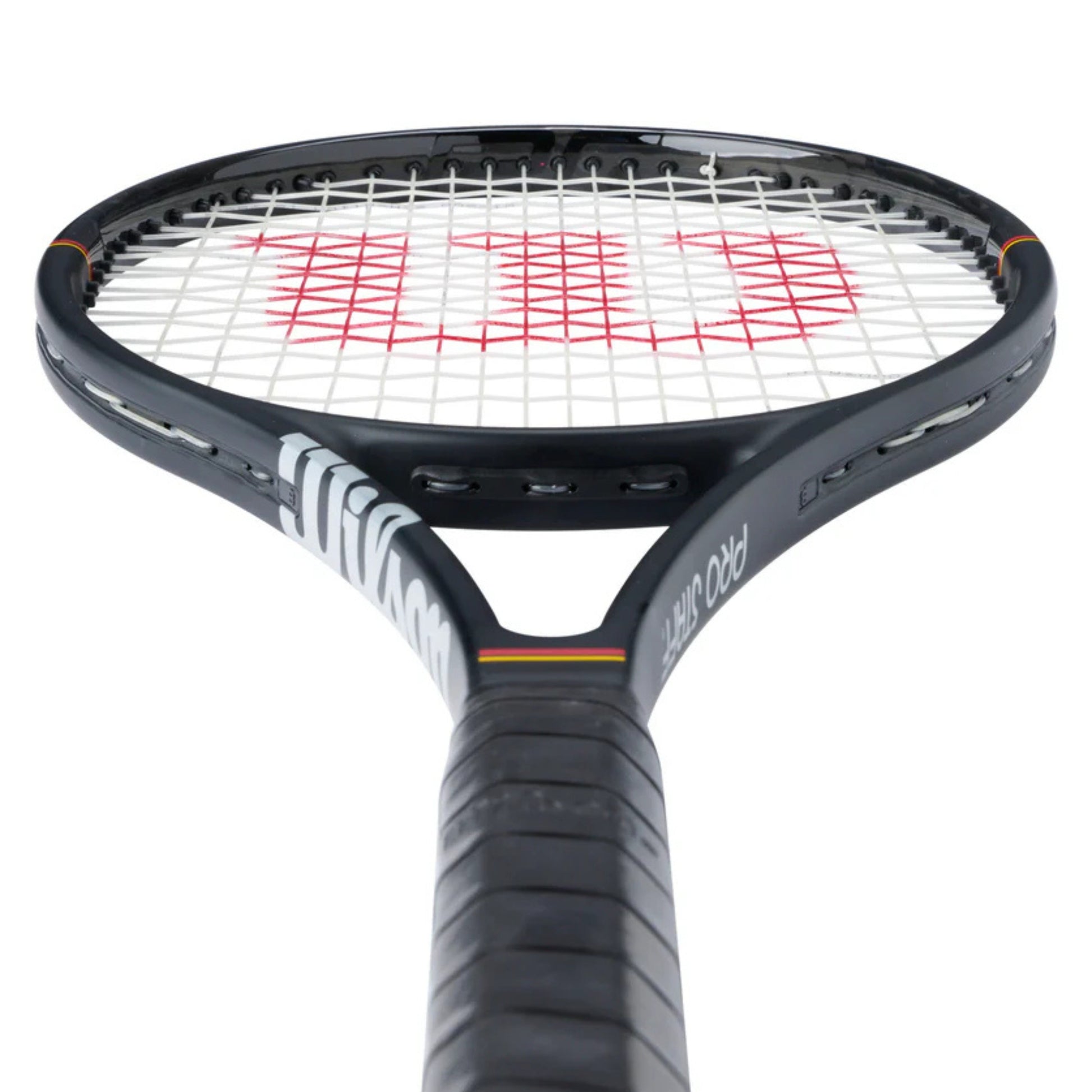 Tennis racket with black frame and red strings on a white background