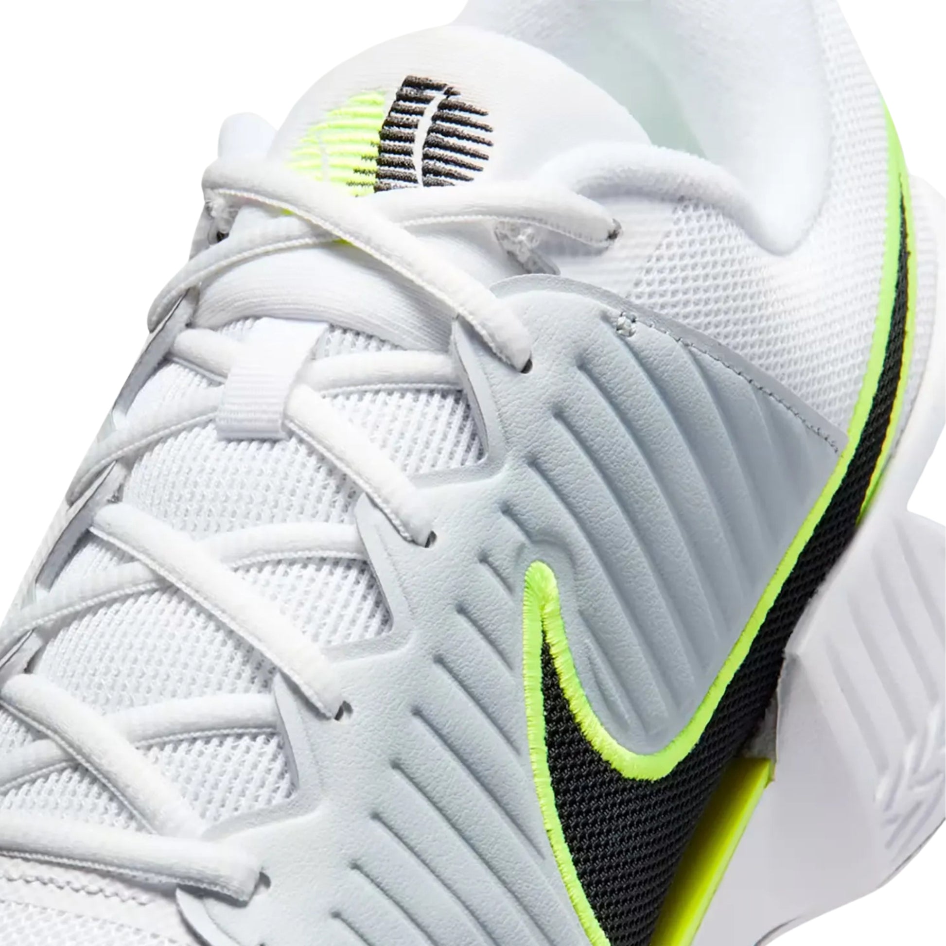 White tennis shoe with black and green accents on a white background
