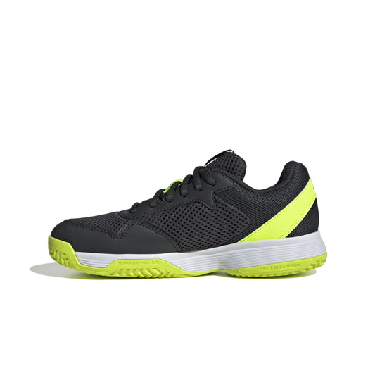 Black and yellow Adidas shoe on a white background