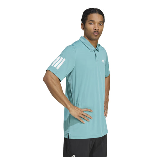 Man wearing a light blue Adidas polo shirt on a white background