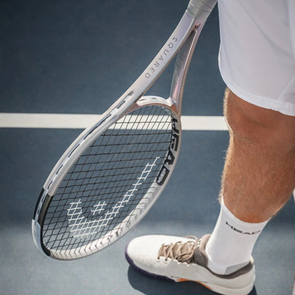 Tennis player holding a racket on a tennis court