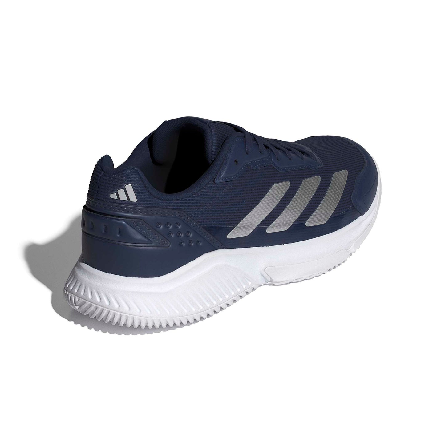Navy adidas padel shoe with the white logo and a white sole on a white background