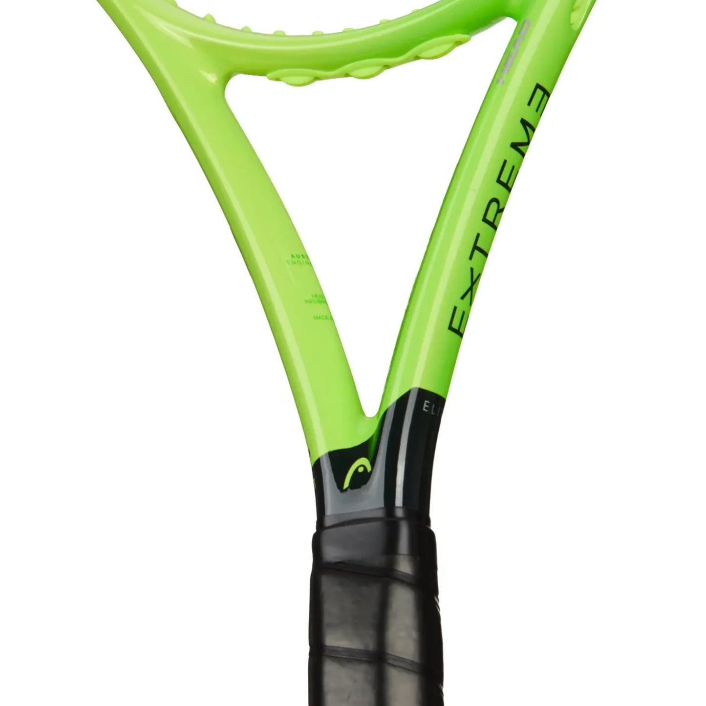 Close-up of a Head tennis racket showing the bright lime green frame with 'EXTREME' printed vertically in black and a black grip handle, on a white background.