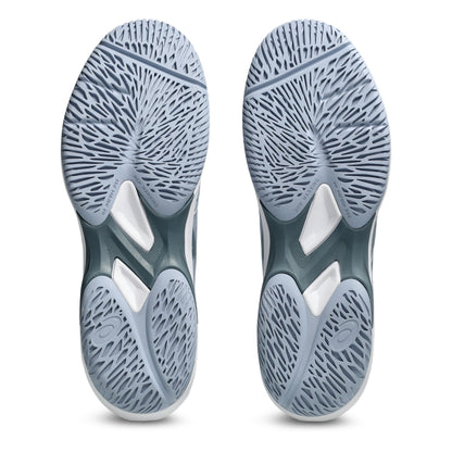 Close-up of a pair of gray tennis shoes with tread pattern on a white background