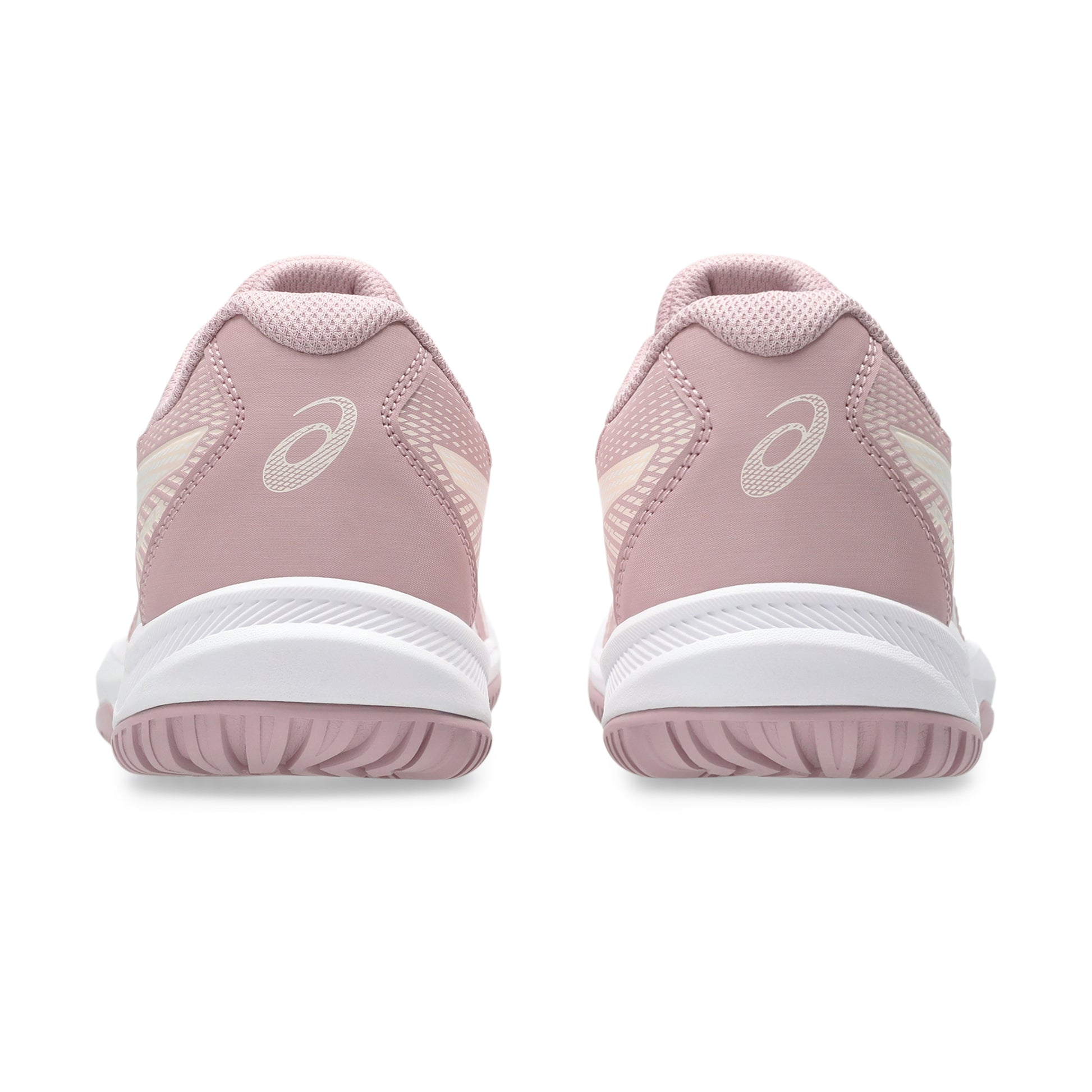 Pink athletic shoes with white soles on a white background