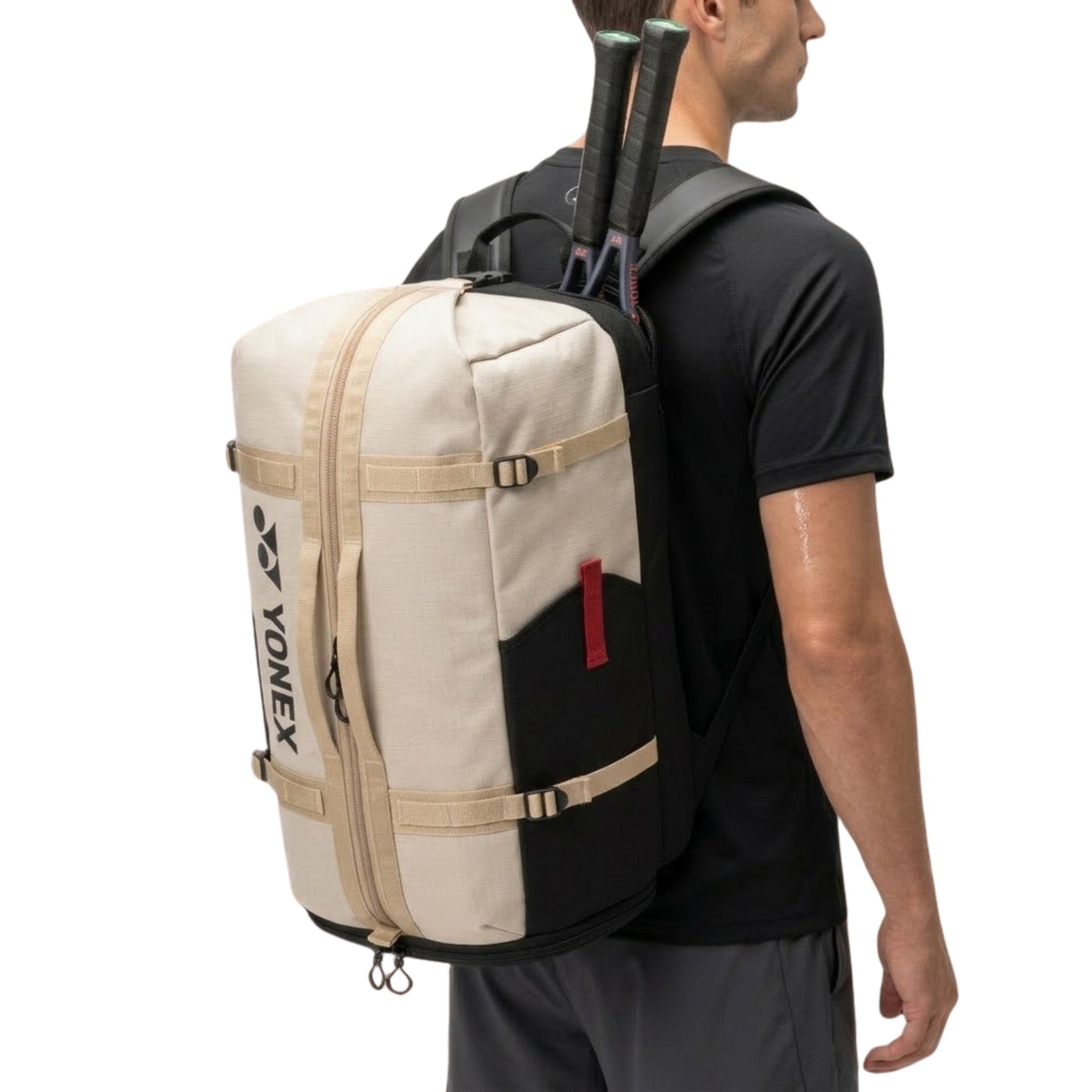 Person wearing a Yonex backpack with tennis rackets on a white background