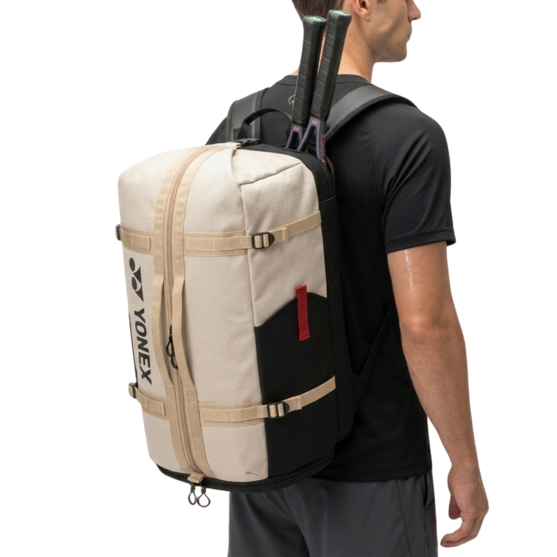Person wearing a Yonex backpack with tennis rackets on a white background