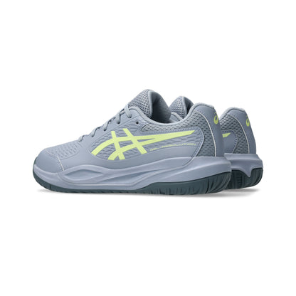 Gray tennis shoe with yellow accents on a white background
